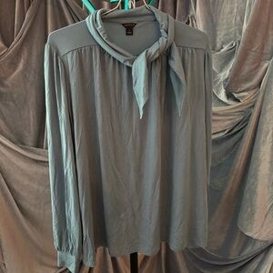 Ann Taylor dusty blue long sleeve top with tie at neck.